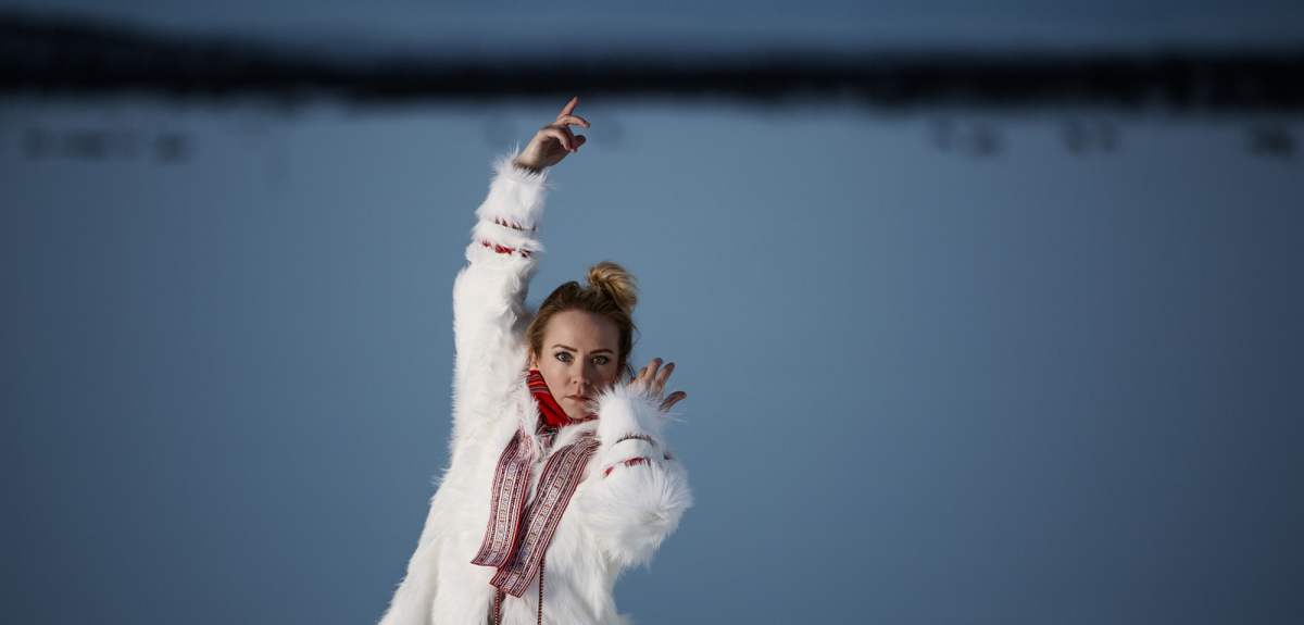 The rebirth of the joik: portrait photo of the Sami artist Elle Márjá Eira outside during winter in Northern Norway.