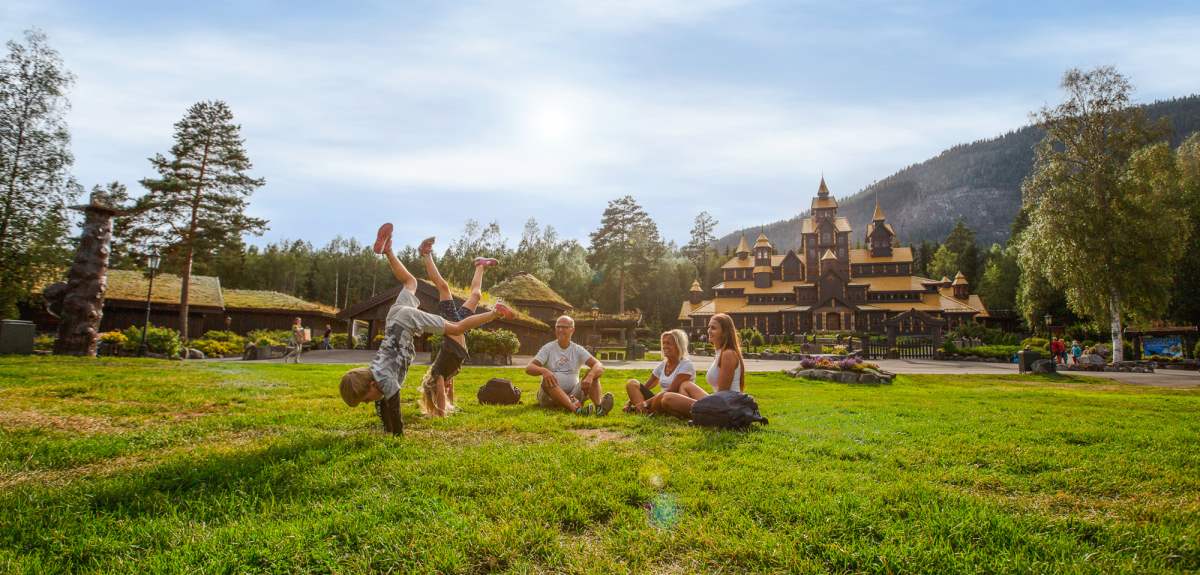 A family is having fun in front of the Fairy Tale Castle in Hunderfossen family park in Lillehammer, Eastern Norway