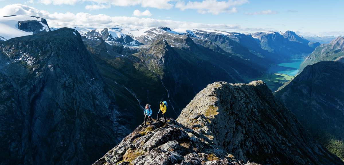 Two people hiking Mount Kattanakken in Jostedalsbreen national park, Fjord Norway