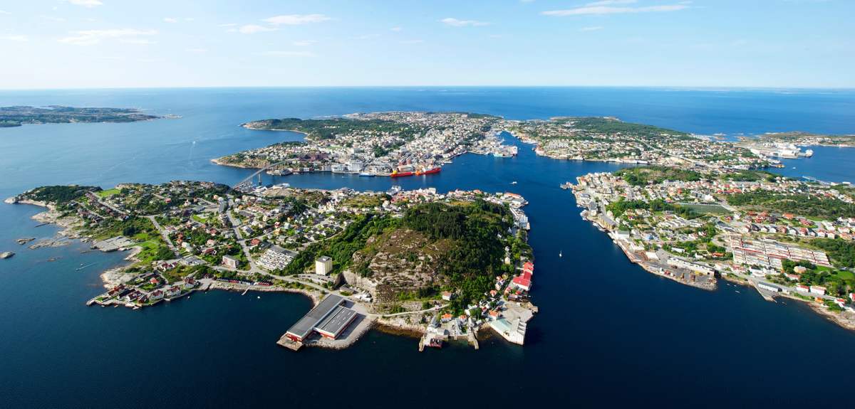 Overview of the city Kristiansund in Fjord Norway from above in the sunshine.