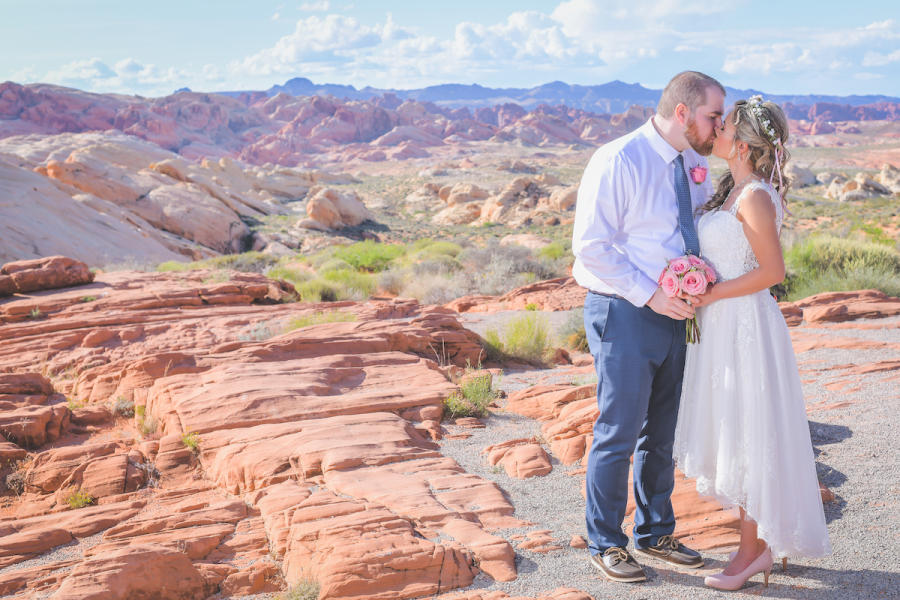 A couple sharing their first kiss as a married couple at Red Rocks outside of Vegas.