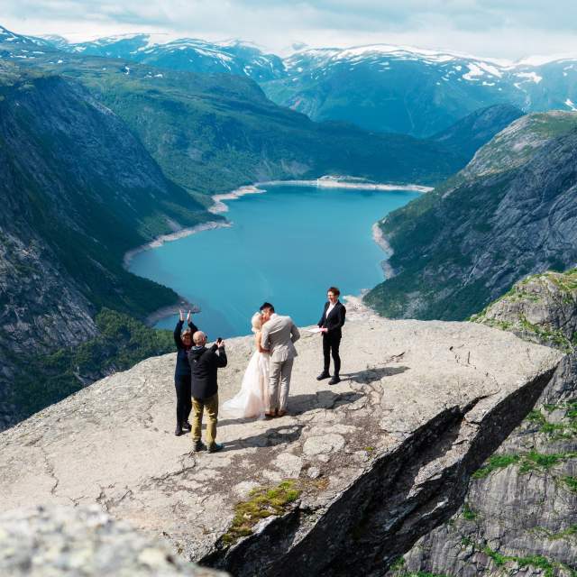 A couple getting married at Trolltunga in Ullensvang in Fjord Norway