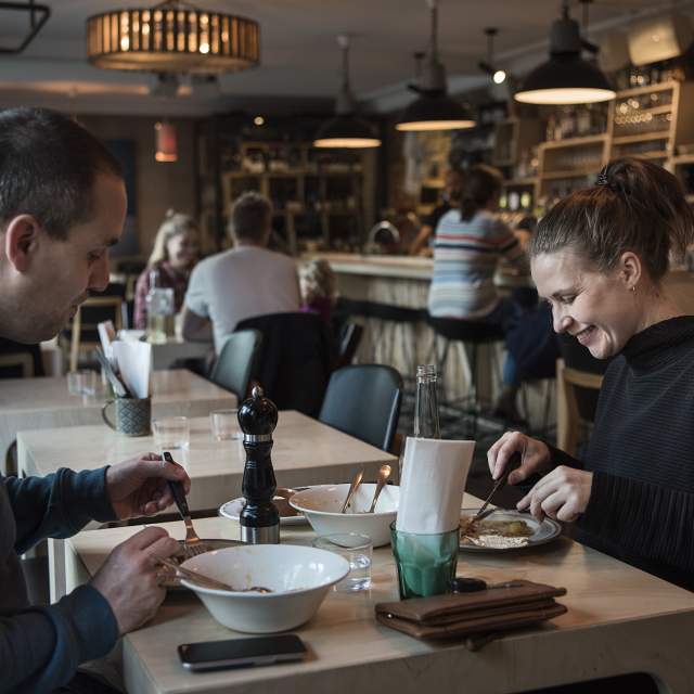 Two people having lunch at Smalhans restaurant, Oslo, Eastern Norway