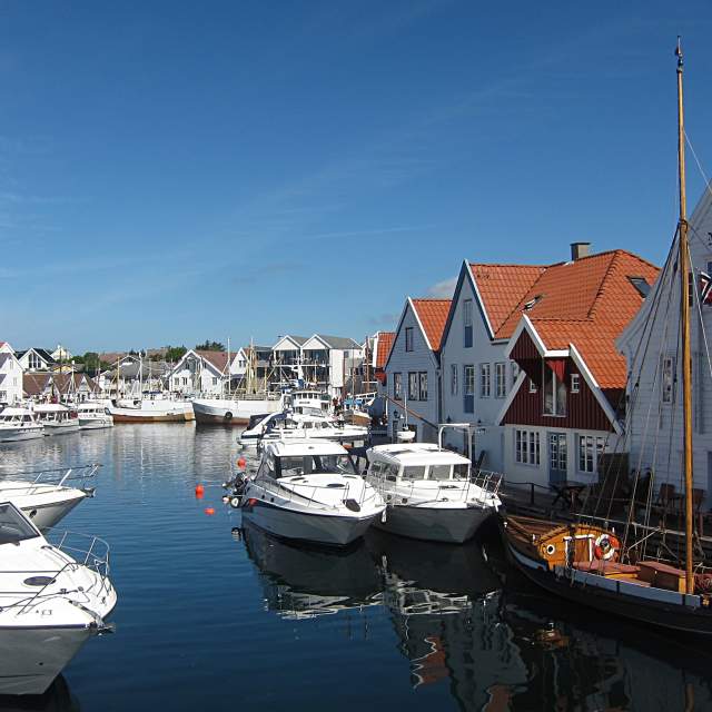 View over white houses and boats in Skudeneshavn, Karmøy, Fjord Norway