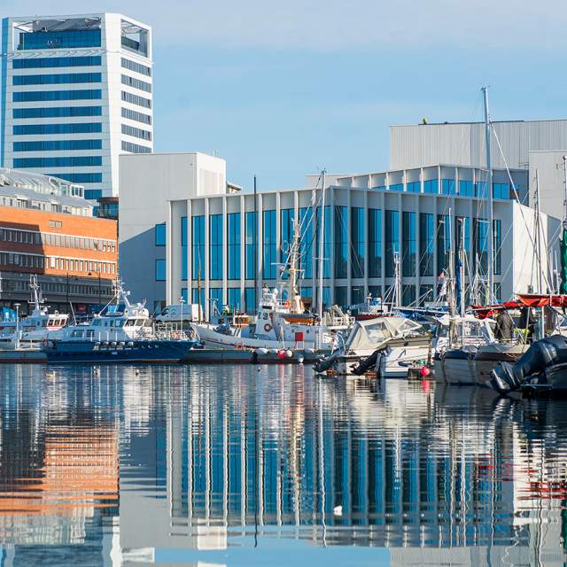 View on the Stormen bibliotek from across the water of the harbour, Bodø, Northern Norway
