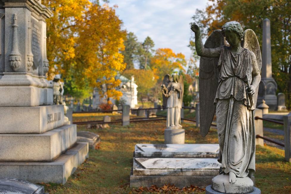 Sleepy Hollow Cemetery - Photo by Jim Logan - Courtesy of Sleepy Hollow Cemetery Stone gravestones and angels at Sleepy Hollow Cemetery