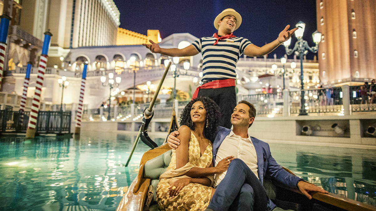 A couple enjoys a gondola ride at The Venetian Resort in Las Vegas