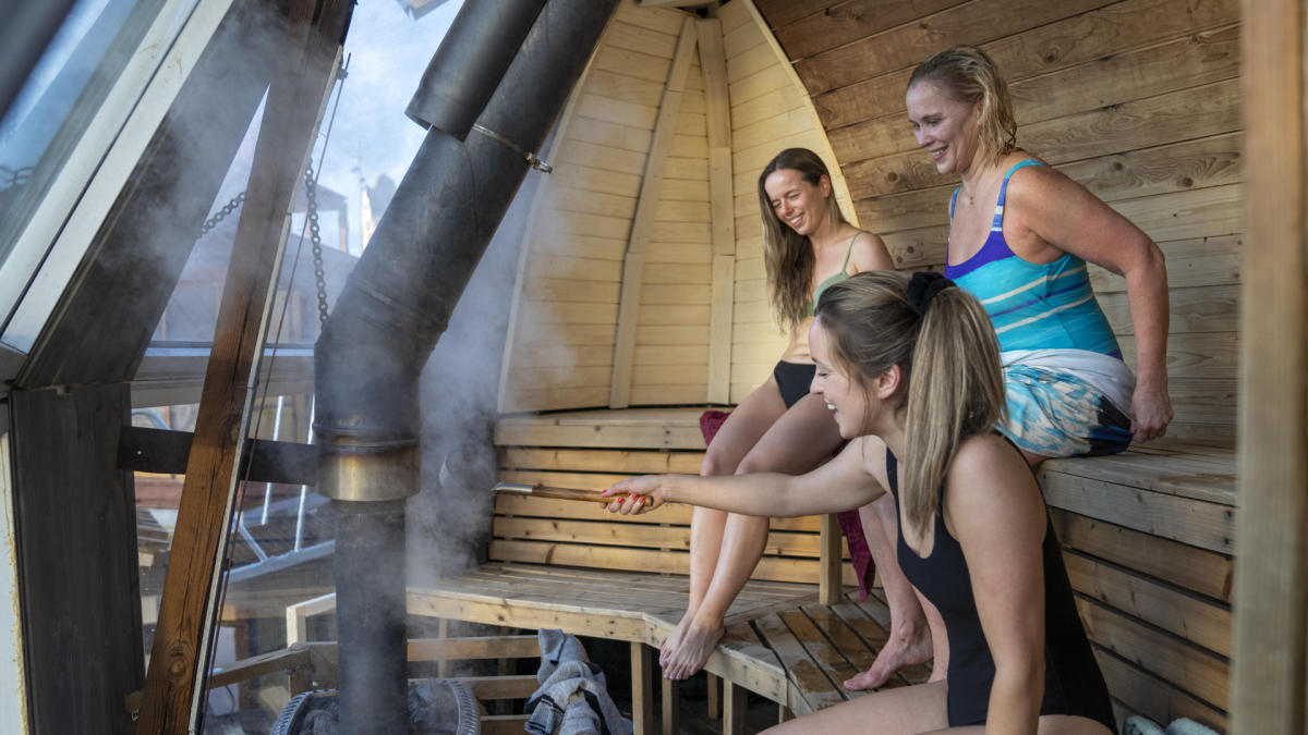 Friends sitting in Sauna at Oslo Badstuforening in Oslo, Eastern Norway