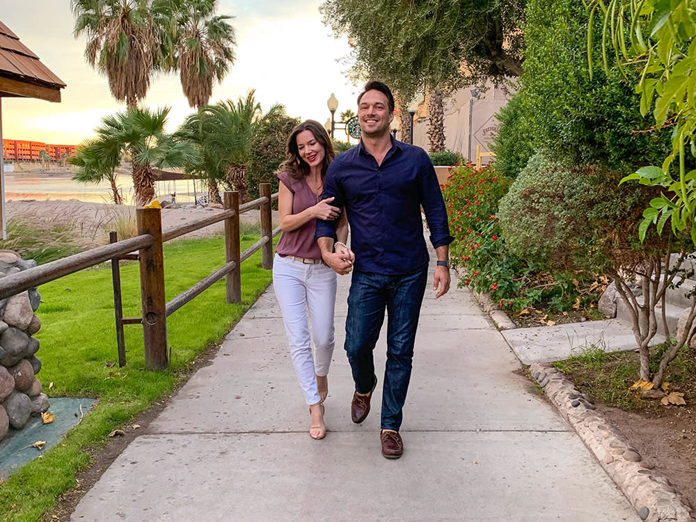 A couple walking and holding hands in Laughlin, NV