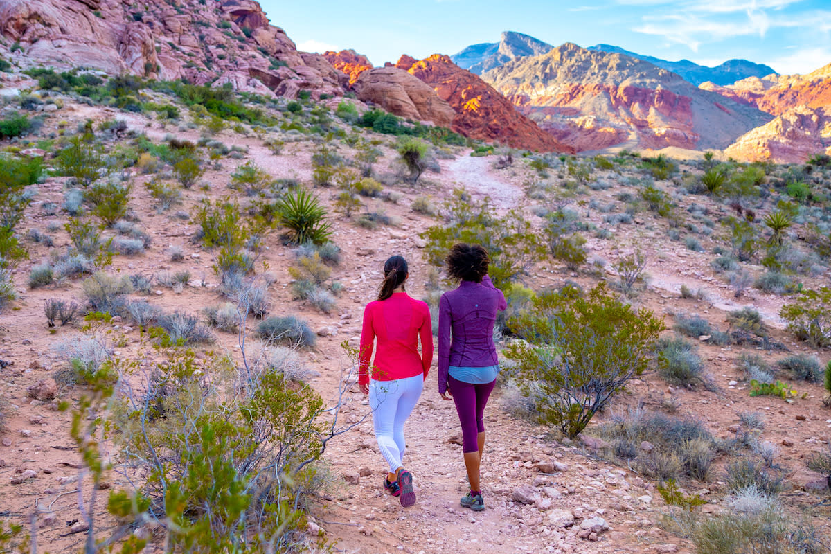 Two women enjoying hiking the beautiful Red Rock Canyon close to Las Vegas.