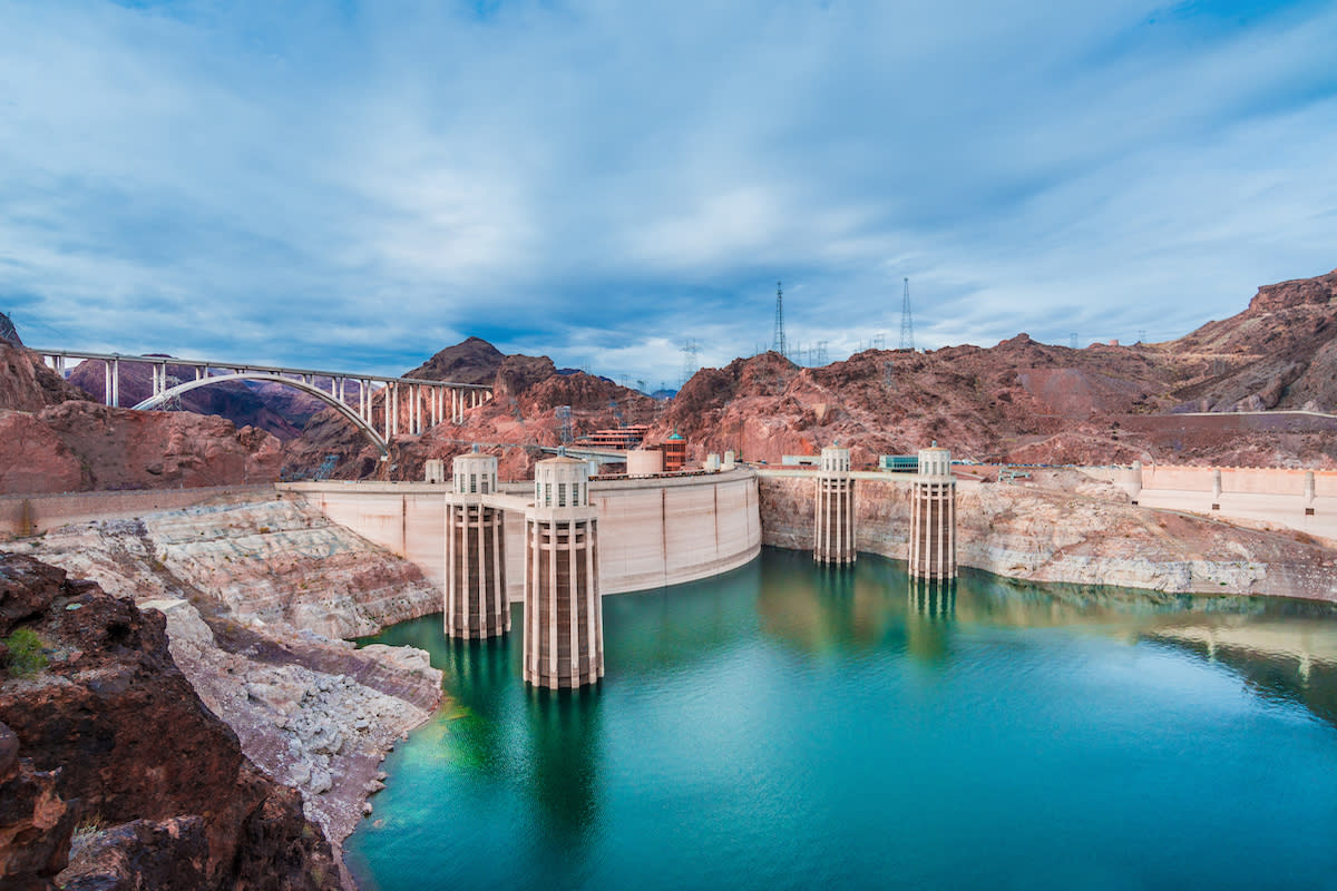Beautiful view of the Hoover Dam with bright green water.
