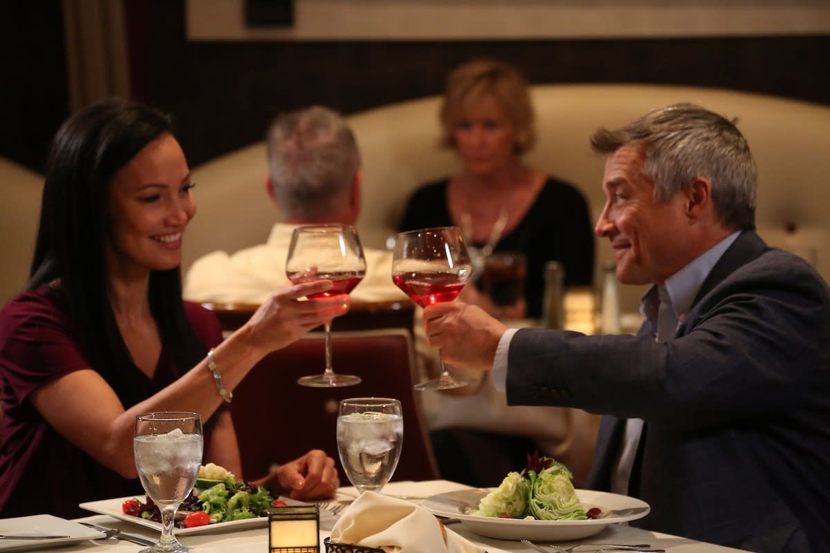 A couple enjoying a dinner and wine at Gregory’s Mesquite Grill inside Eureka Casino Resort.