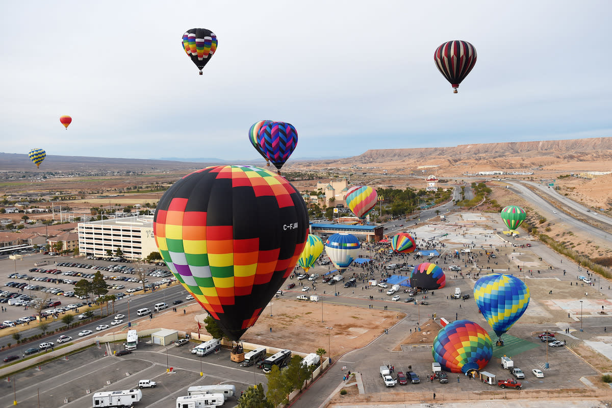 Hot air balloons rising into the air at the Hot Air Balloon Festival in Mesquite.