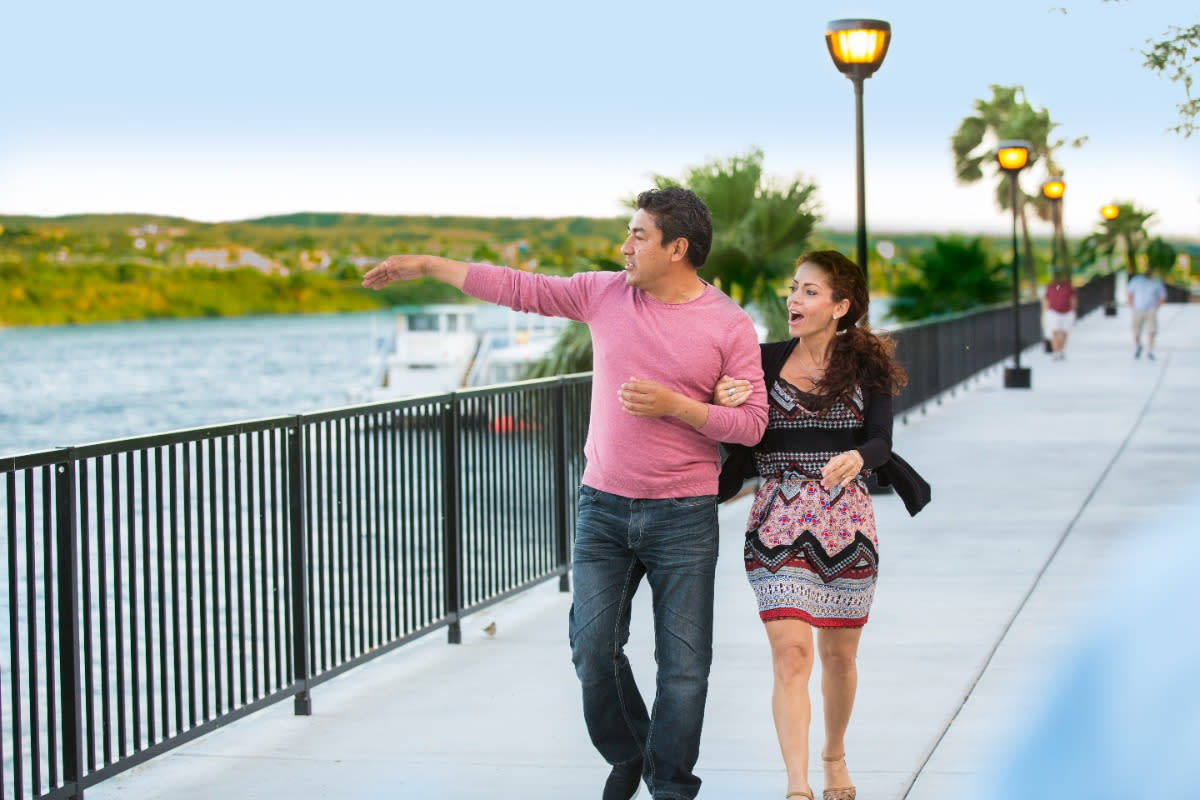 A couple enjoying a walk at Laughlin River Walk.