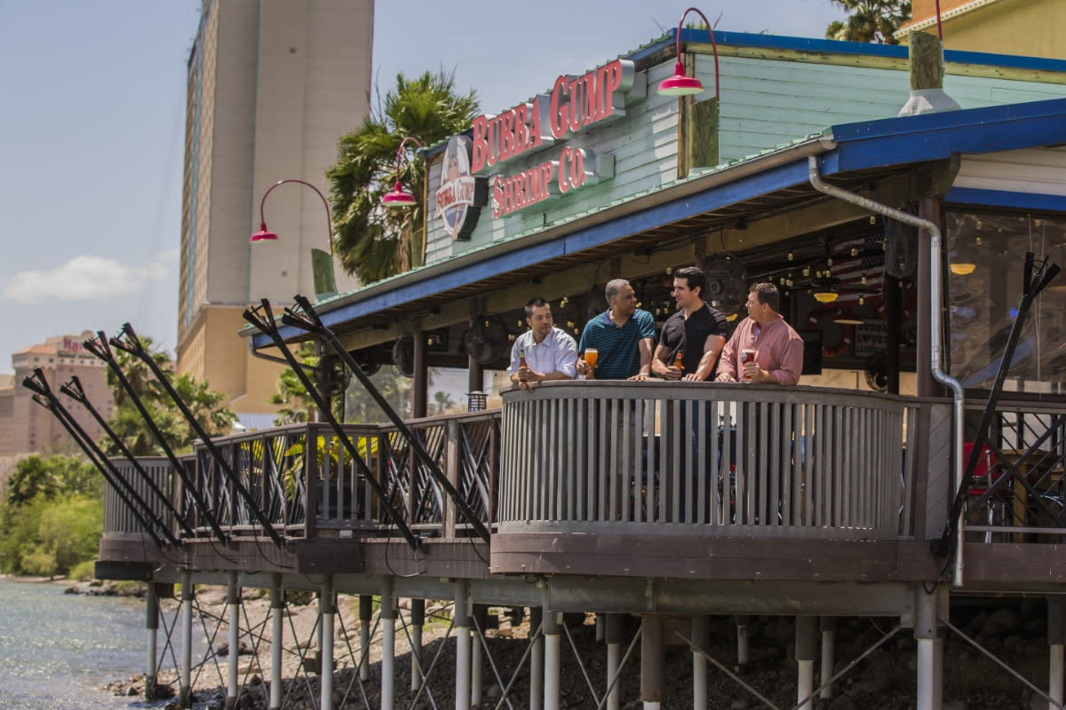 A group of guys enjoying themselves at the famous Bubba Gump Shrimp Co.