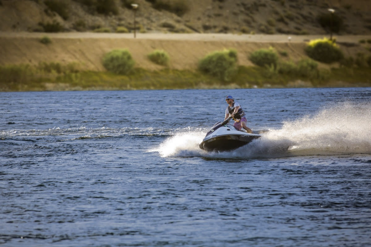 A man catching some waves on his jet ski in Laughlin.
