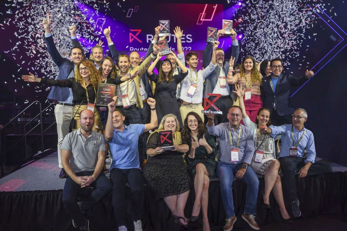 A group of people celebrating at Routes World 2022.