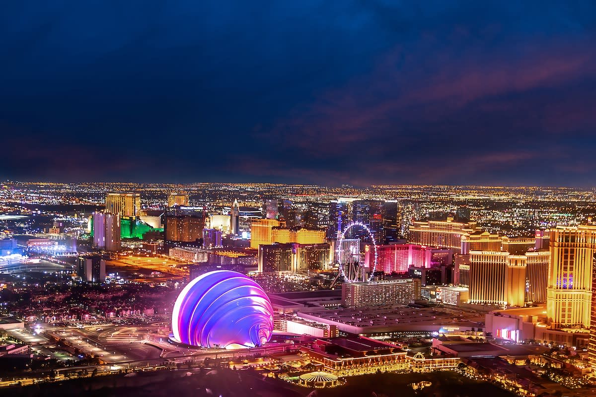 View of the brightly lit Vegas strip, highlighting the Sphere.