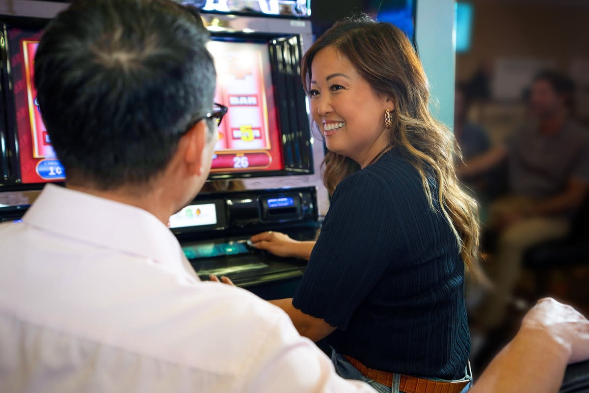 Two people enjoying themselves playing games at Don Laughlin’s Riverside Resort Hotel & Casino.