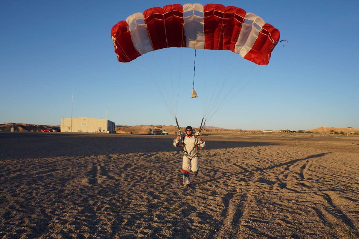 Someone landing on the ground after skydiving in Mesquite.