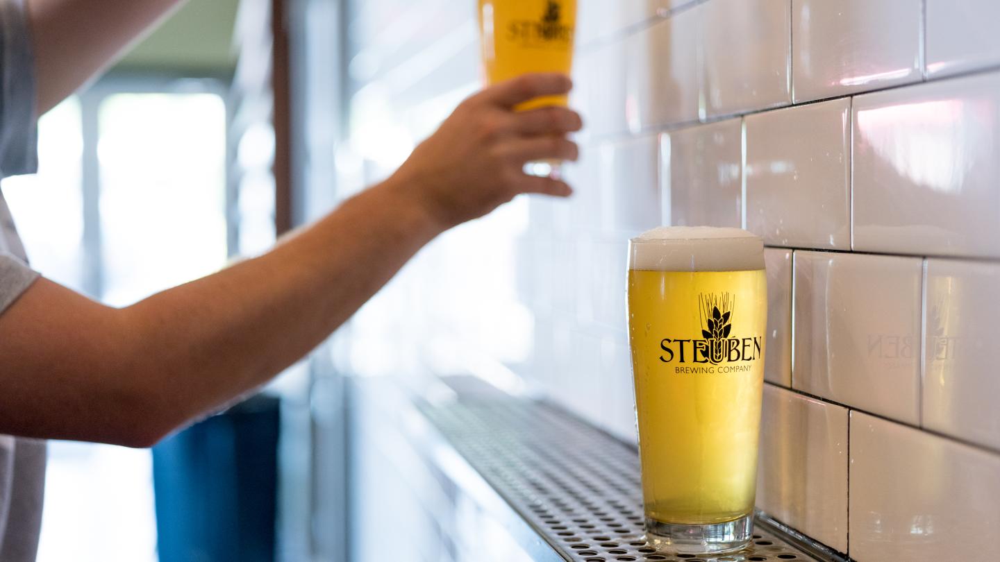 pouring a glass of craft beer