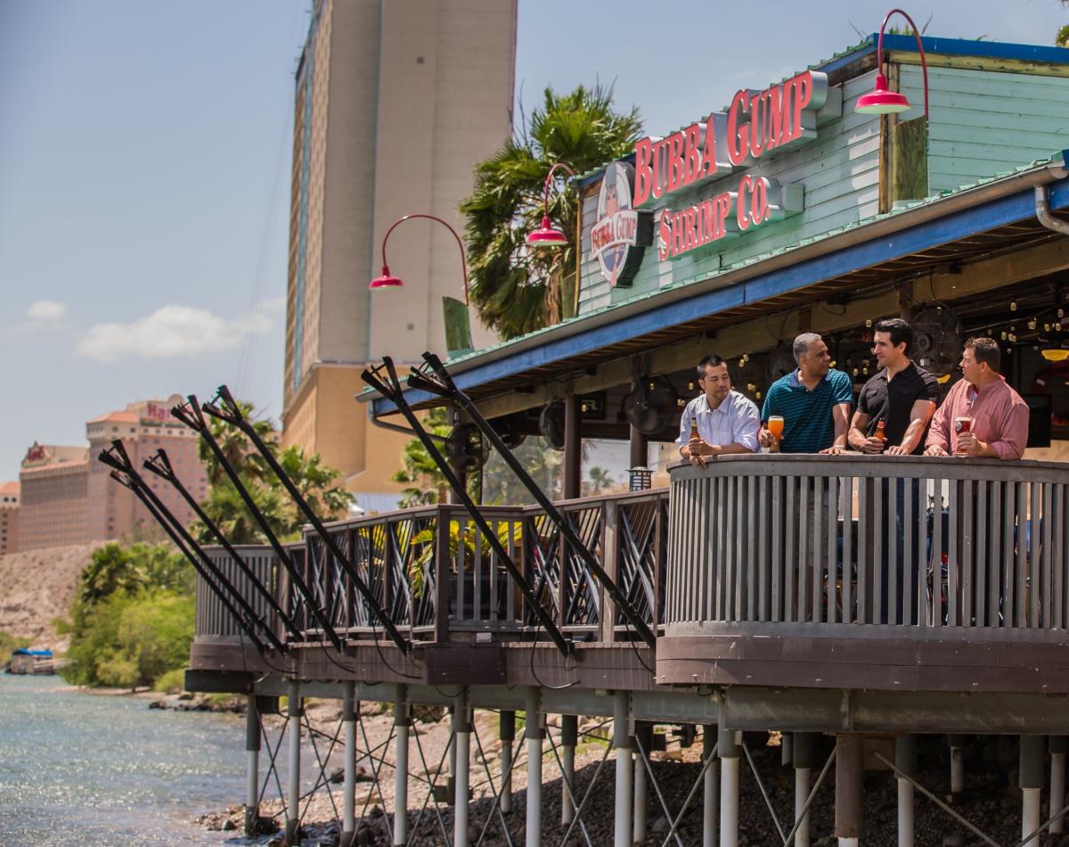 Men having beers on balcony at Bubba Gump Shrimp Co. in Laughlin