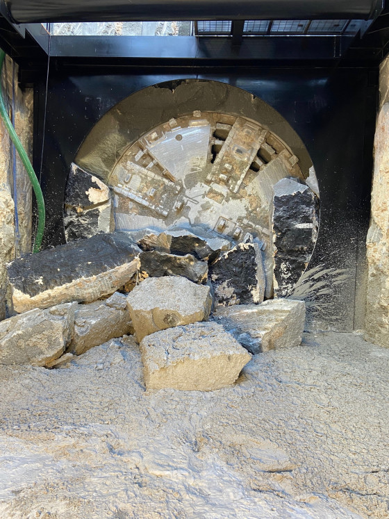 Boring machine breaks through marking end of excavation for first tunnel