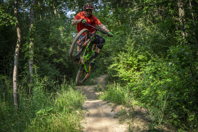 Mountain biker jumping a trail near Grand Rapids
