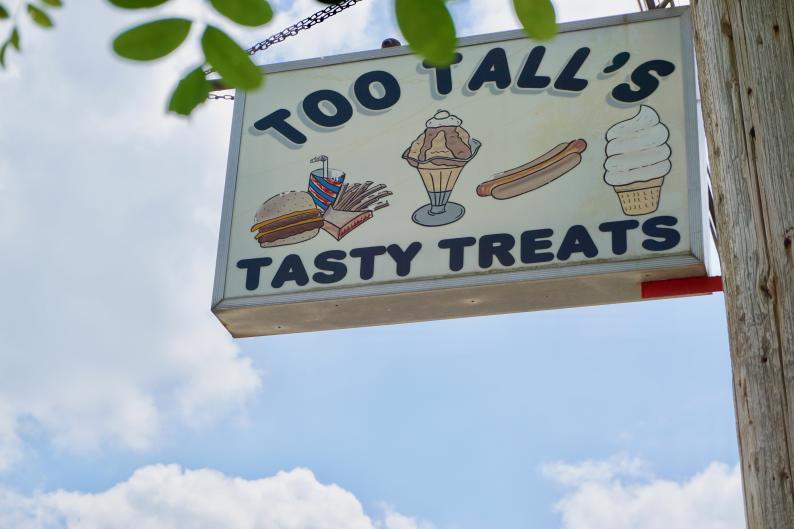 Too Tall's sign