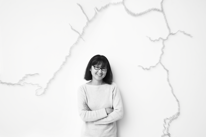 Maya Lin in front of her work, Pin River -- Grand River Watershed (detail).