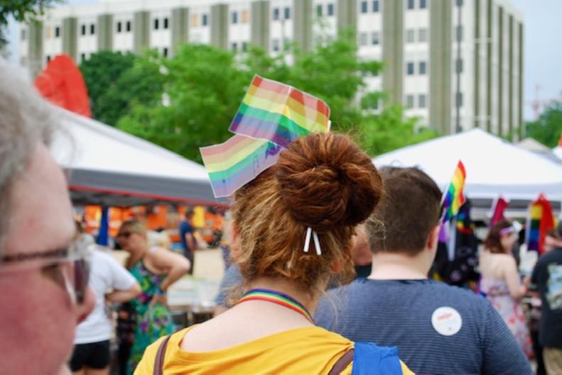 Attendee wearing pride flags in her hair at the Grand Rapids Pride Festival