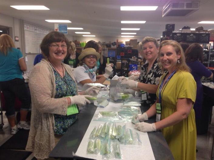 OrgPro 2014 attendees volunteering at Kids' Food Basket