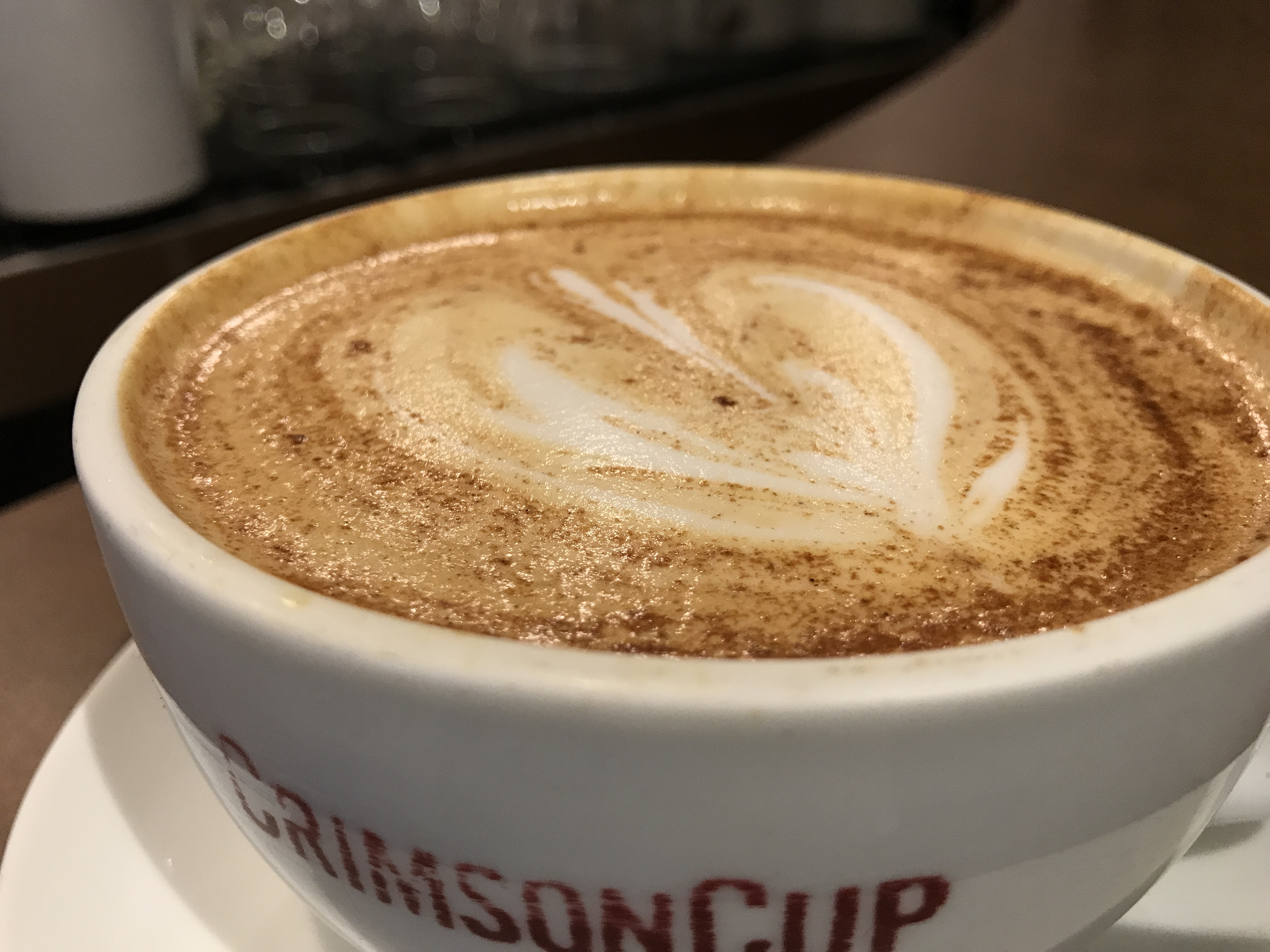 Close-up of a frothy, foamy cup of coffee from Crimson Cup