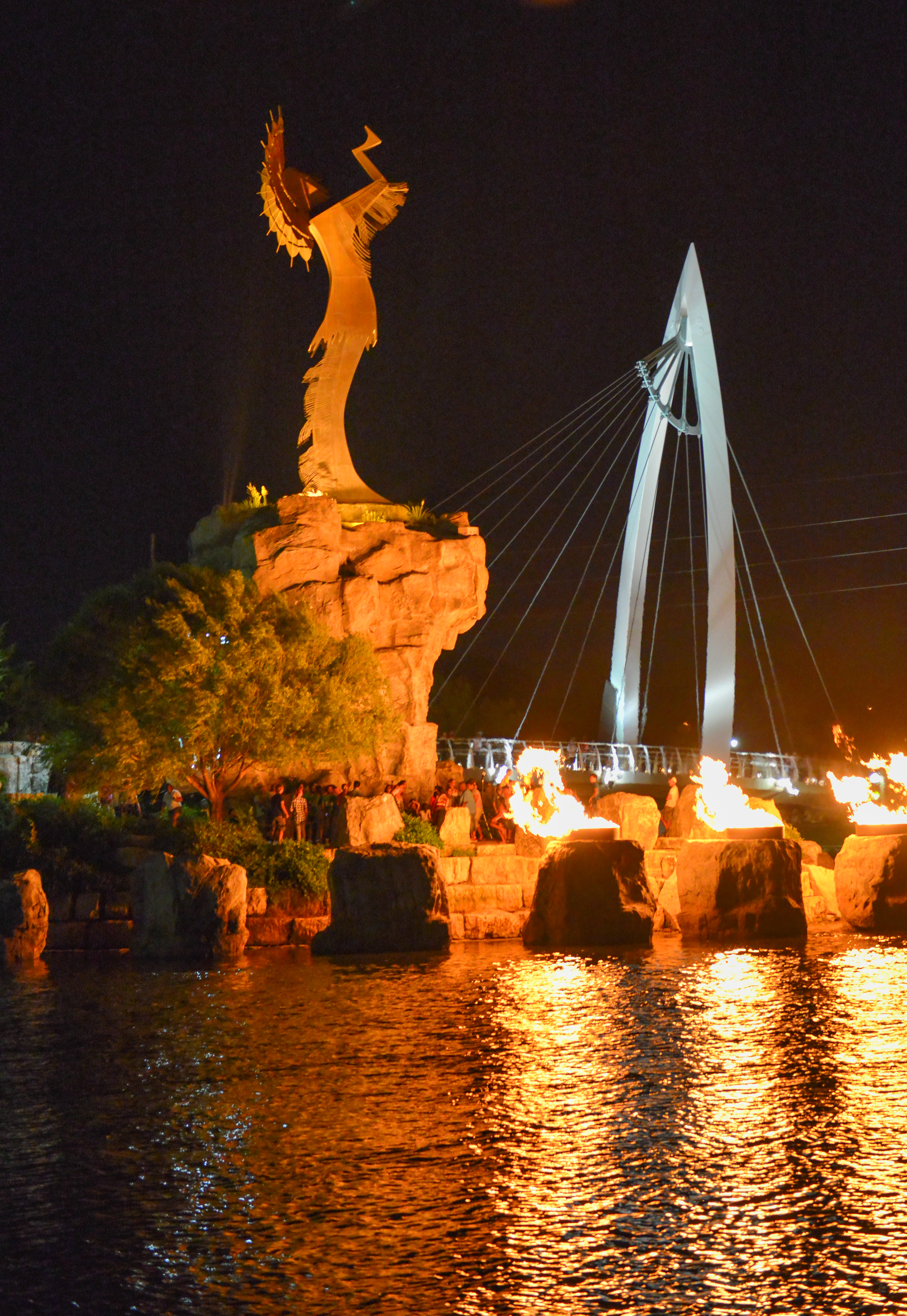 The Keeper of the Plains statue at night with the ring of fire celebration.