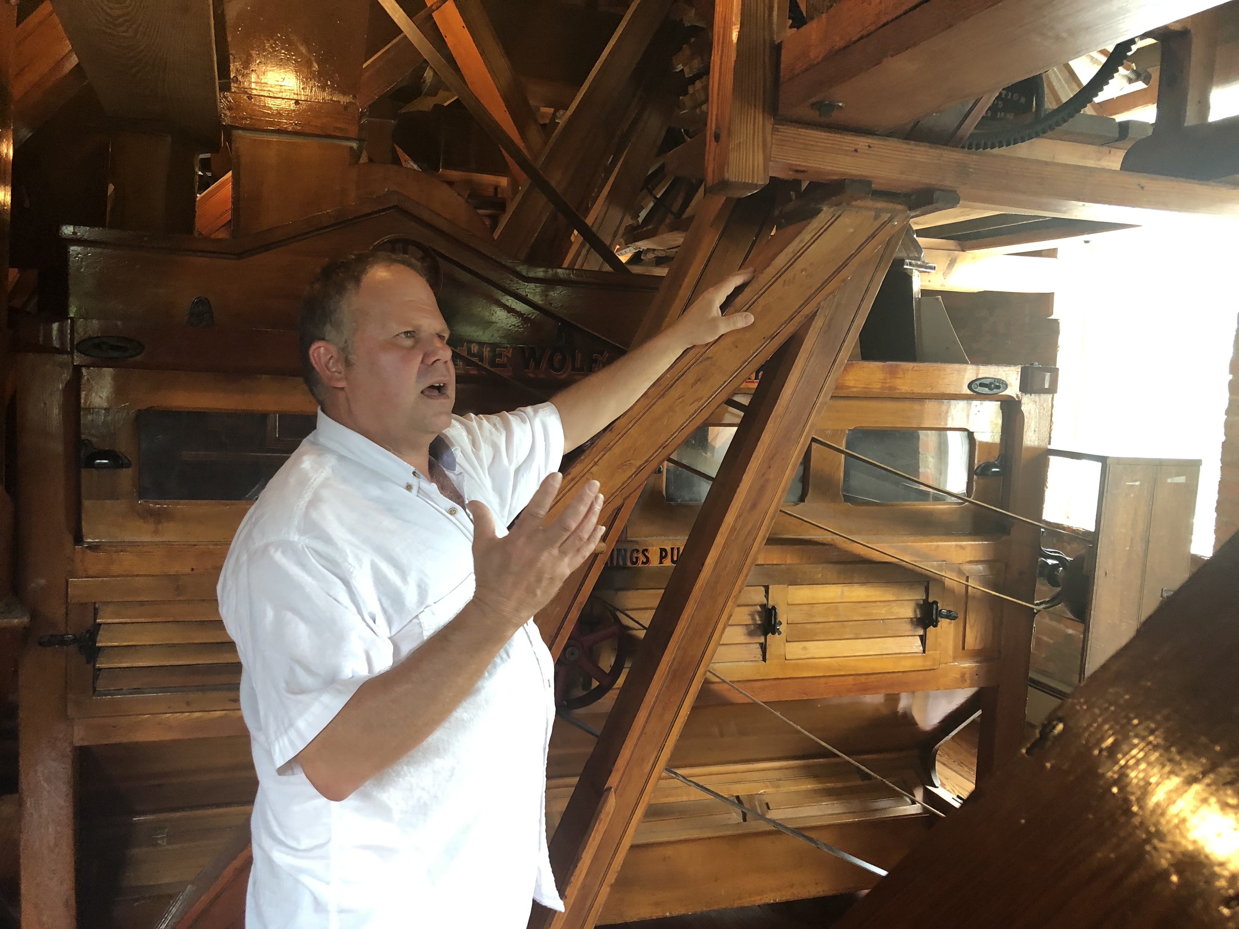 Man giving Smoky Valley Roller Mill Tour in Lindsborg, KS