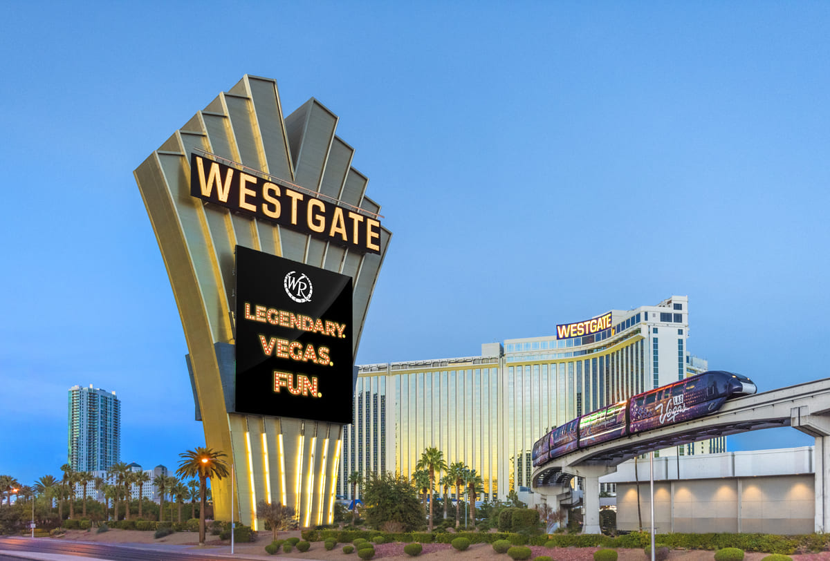 Aerial view of Westgate Las Vegas Resort and Casino tower surrounded by palm trees