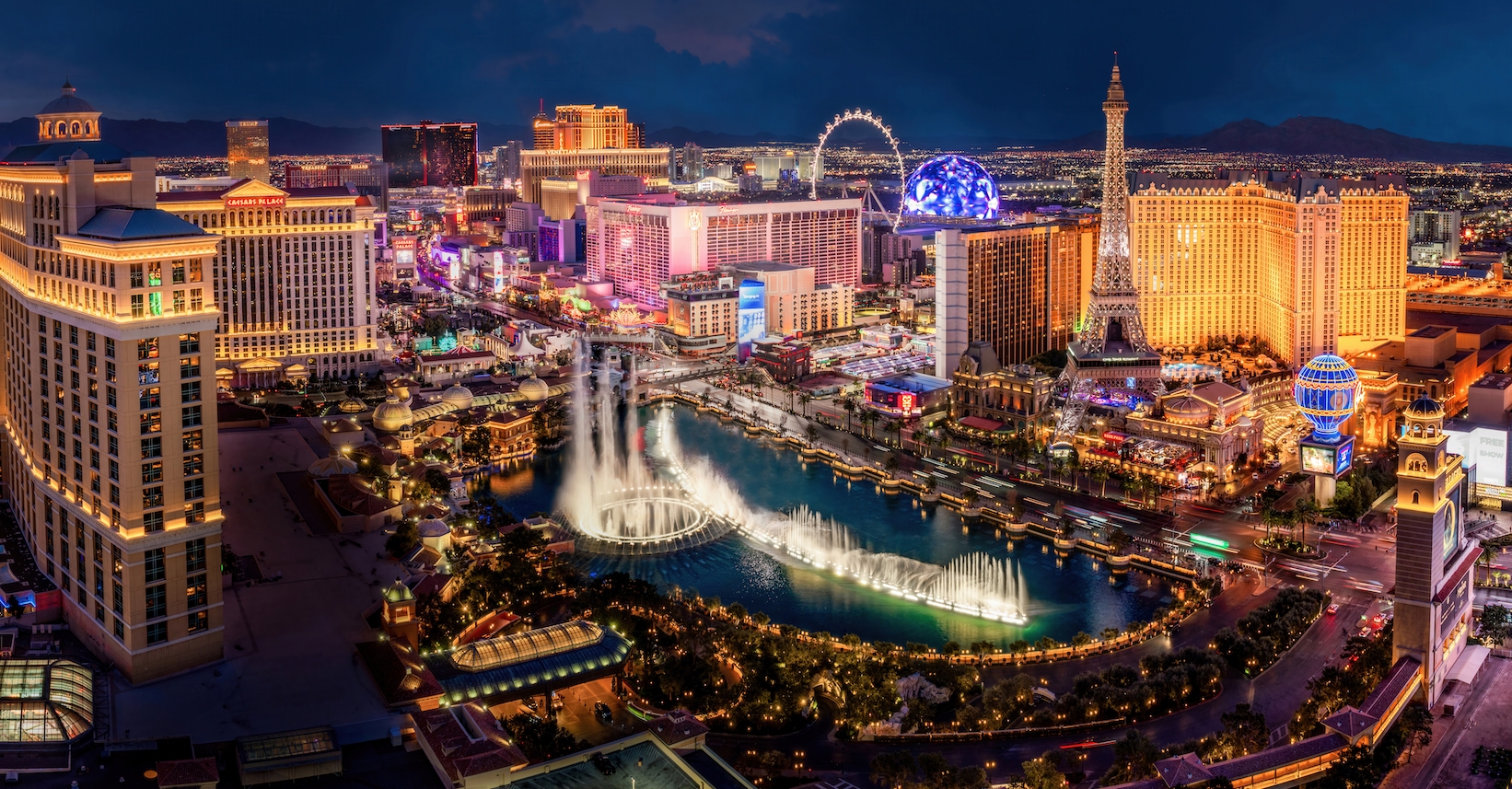 Vibrant nightlife scene at a Las Vegas pool party with neon lights and crowds celebrating
