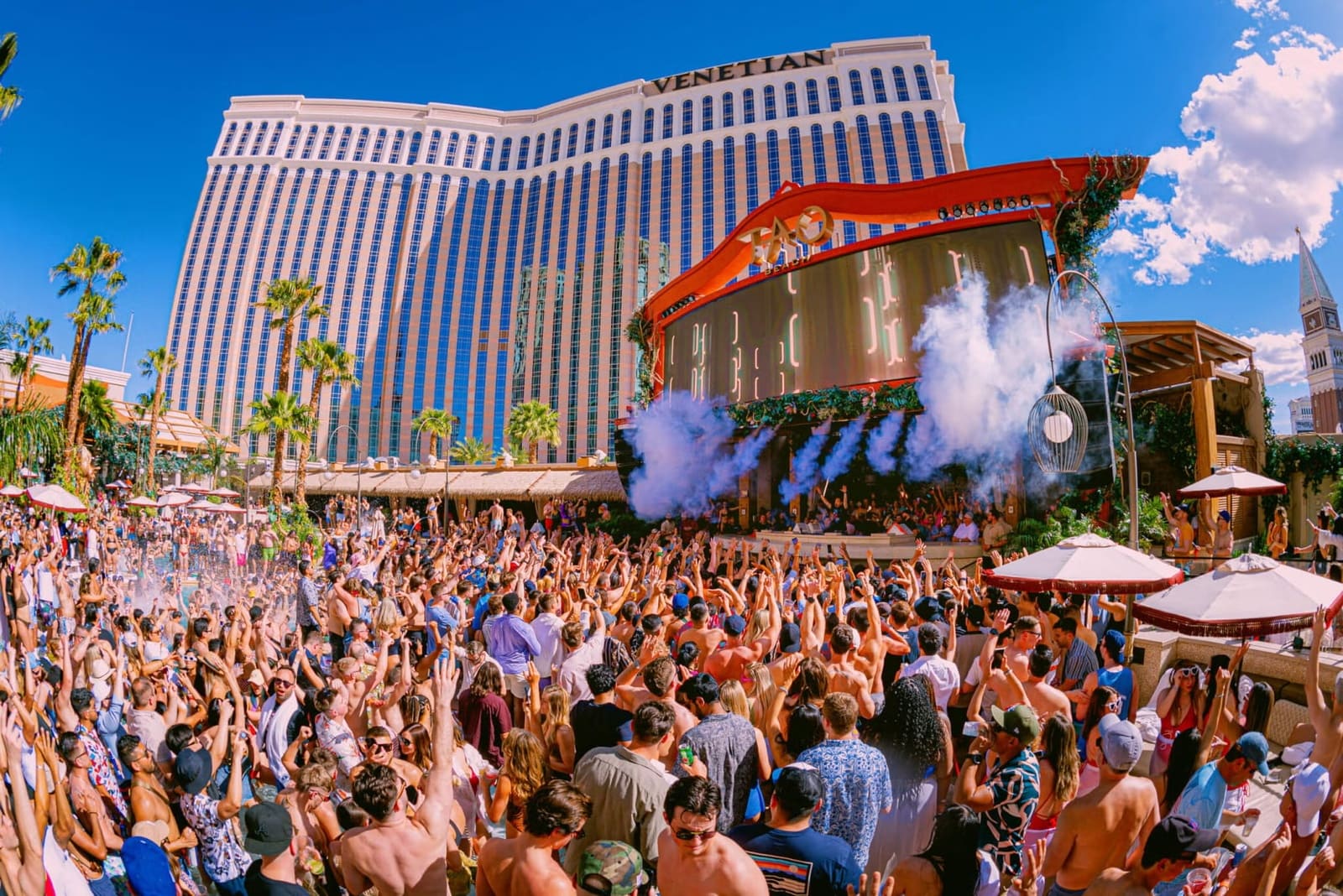 TAO Beach dayclub at The Venetian Las Vegas with tropical pool setting and DJ stage