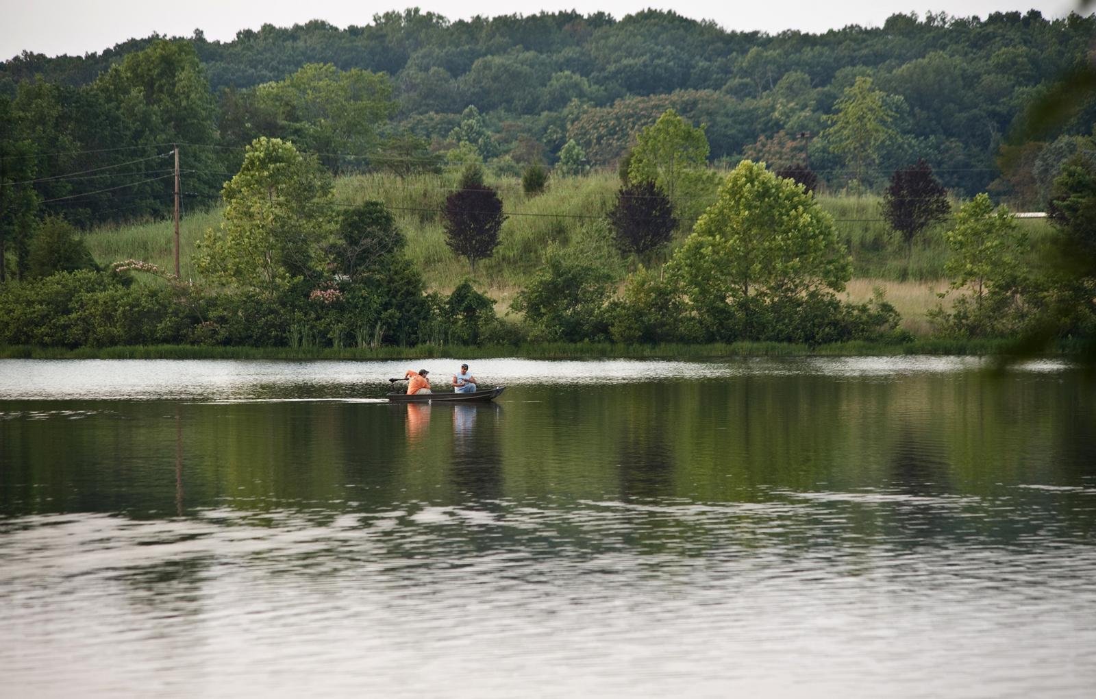 2 men fishing in a canoe at Silver Lake Regional Park