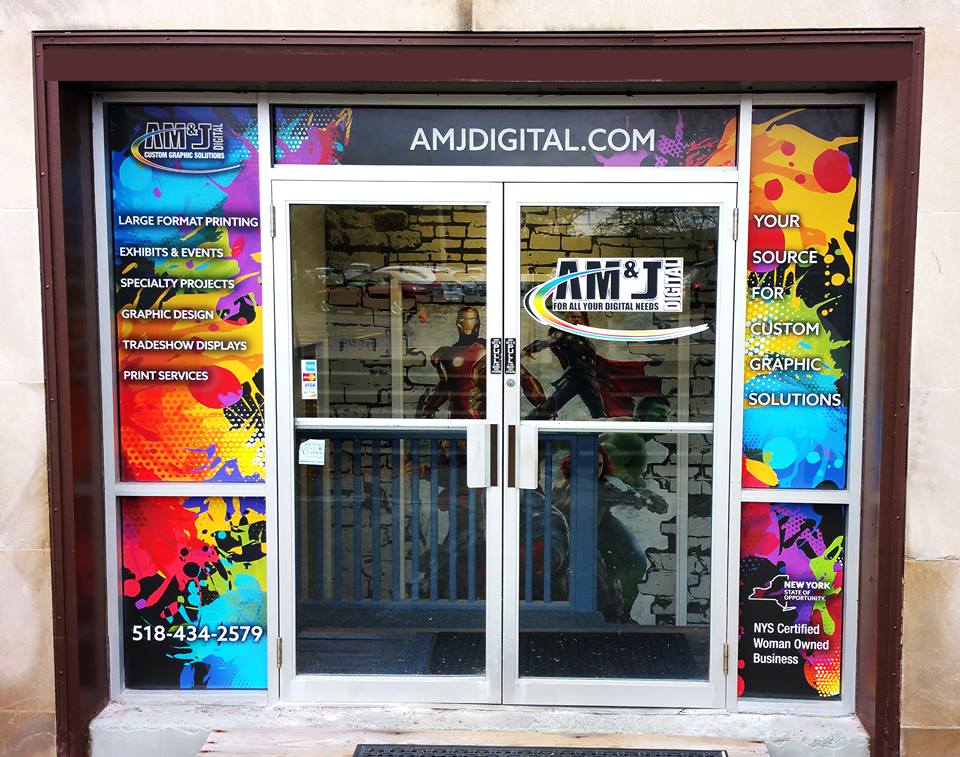 Colorful signage at AM & J Digital entryway