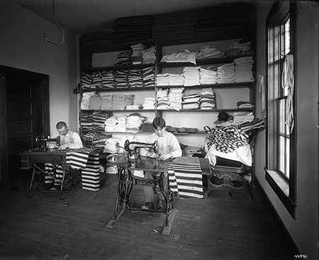Tailor Shop, U.S. Penitentiary, McNeil Island, photographic print from glass plate negative, circa 1909, by Asahel Curtis.