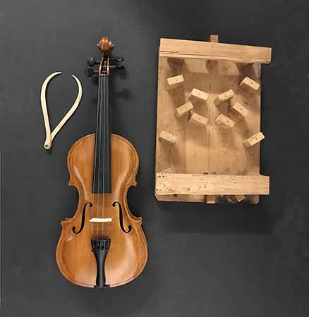 Conscientious objector Howard Scott created the parts for this violin by hand using wood scraps found during his incarceration at McNeil Island during World War II.